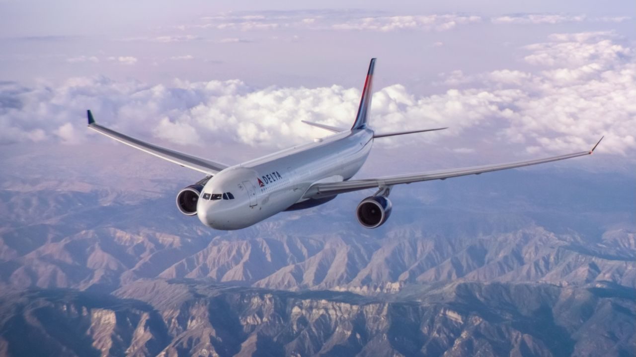 An Airbus 330-300 (333) flying over mountains.- | These images are protected by copyright. Delta has acquired permission from the copyright owner to use the images for specified purposes and in some cases for a limited time. If you have been authorized by Delta to do so, you may use these images to promote Delta, but only as part of Delta-approved marketing and advertising. Further distribution (including providing these images to third parties), reproduction, display, or other use is strictly prohibited.